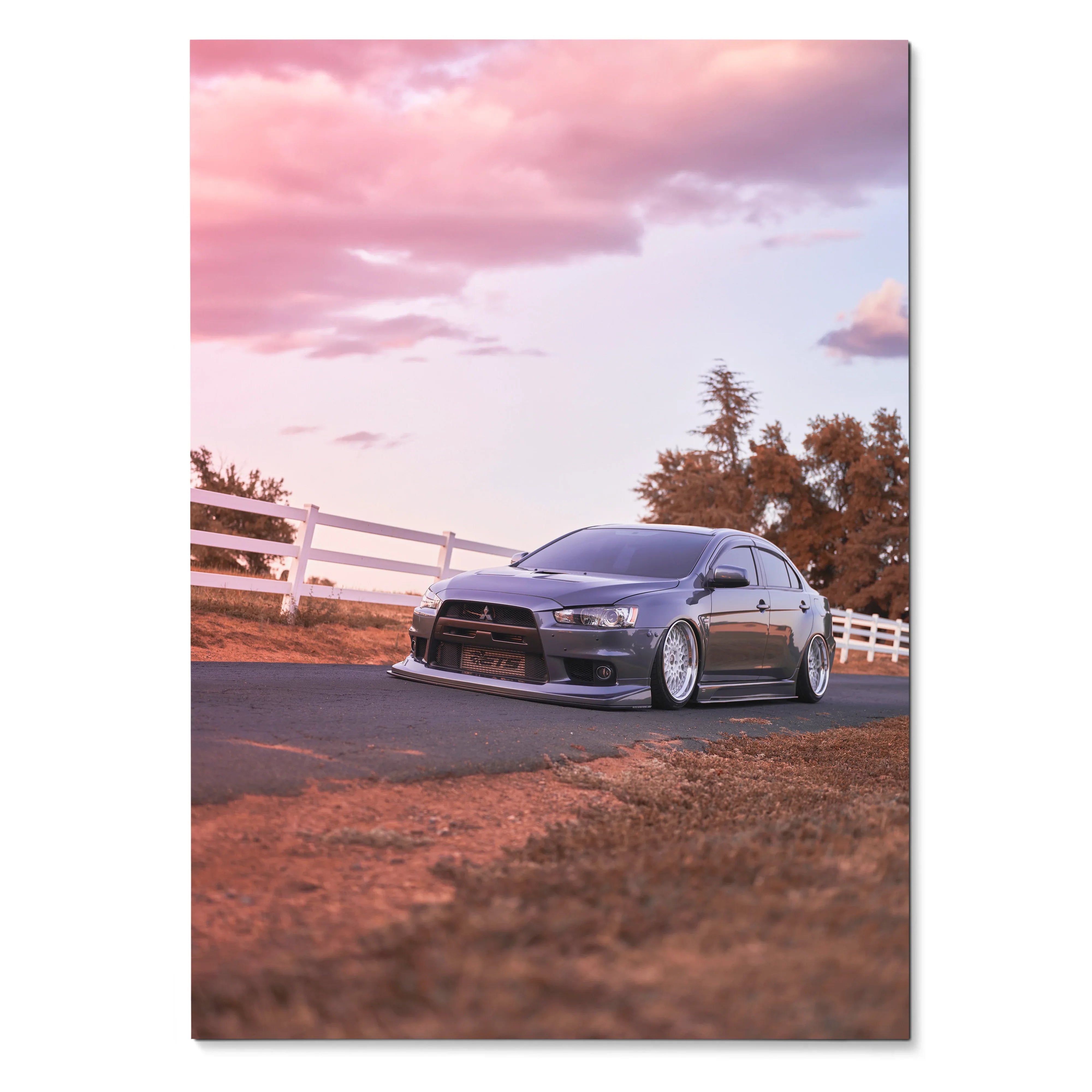 Mitsubishi Evo 10 parked on rural road with sunset sky poster wall art.