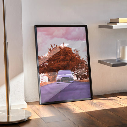 Mitsubishi Evo 10 car poster with pink sky and autumn tree wall art in black frame.