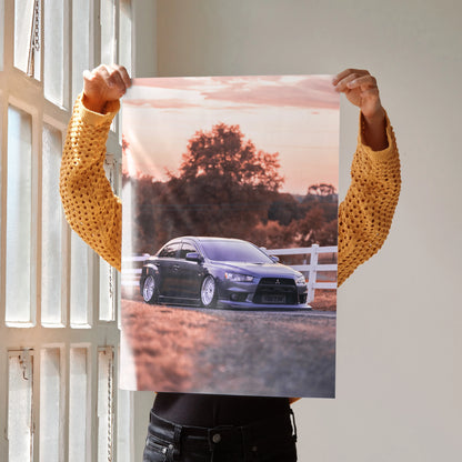 Mitsubishi Evo 10 poster wall art with sunset background and black sports car silhouette.