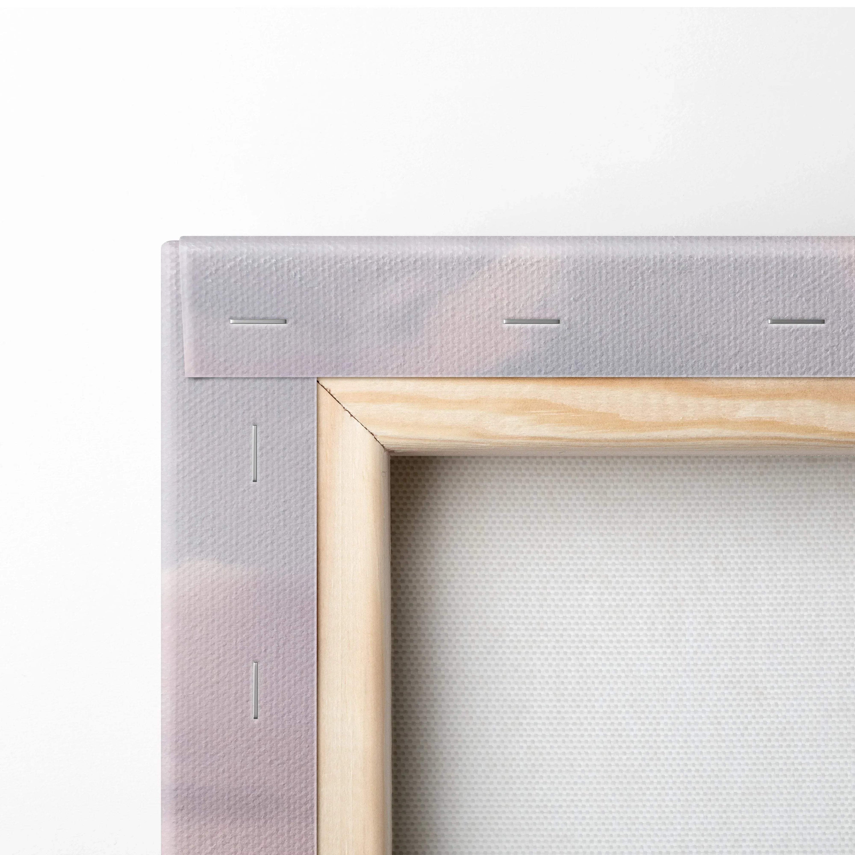 Close-up of corner on vertical canvas art with wooden frame and stretched fabric for wall art display.
