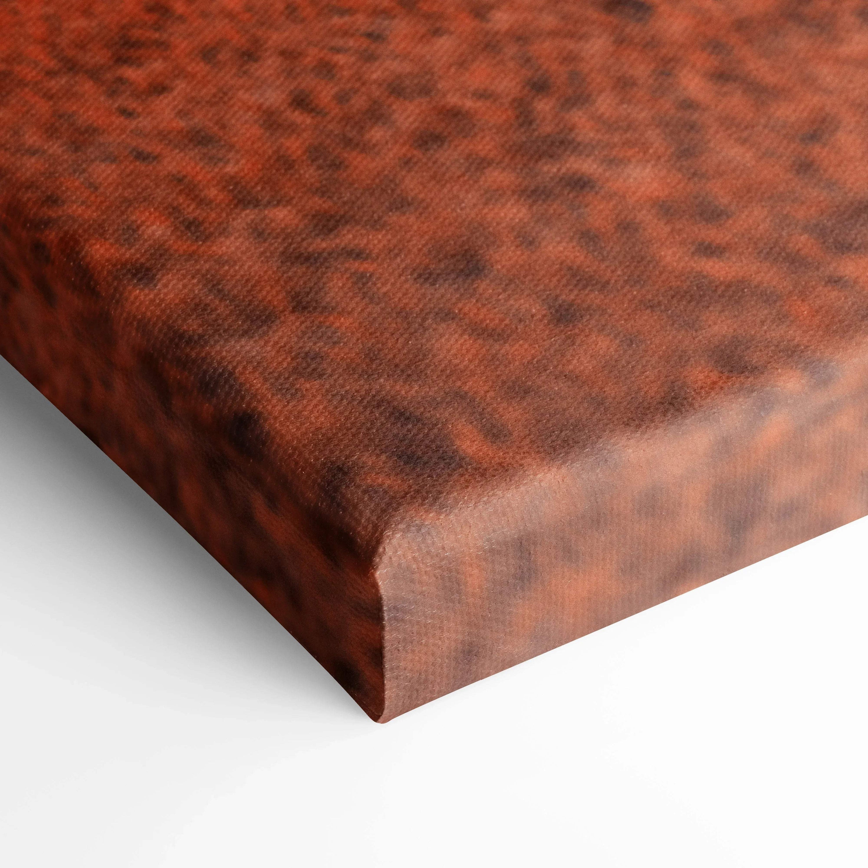 Close-up of textured brown canvas wall art with rich, warm tones and detailed surface pattern.