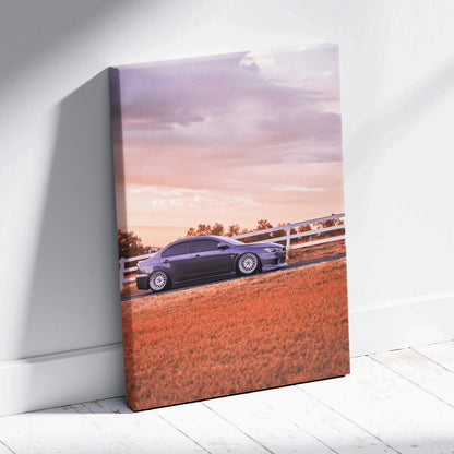 Mitsubishi Evo 10 parked by white fence at sunset canvas wall art vertical canvas print.