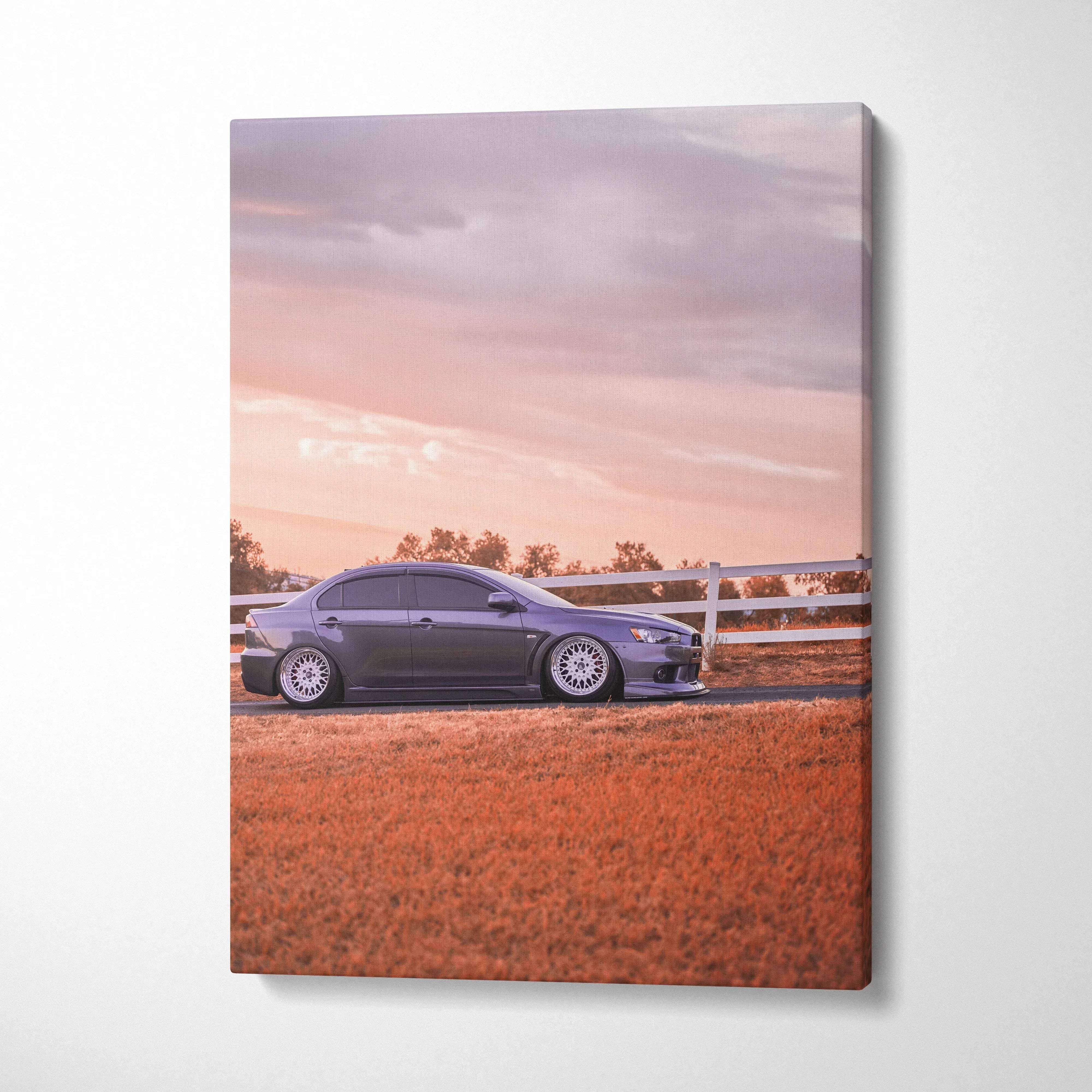 Mitsubishi Evo 10 parked on orange grass with cloudy sky on vertical canvas wall art.