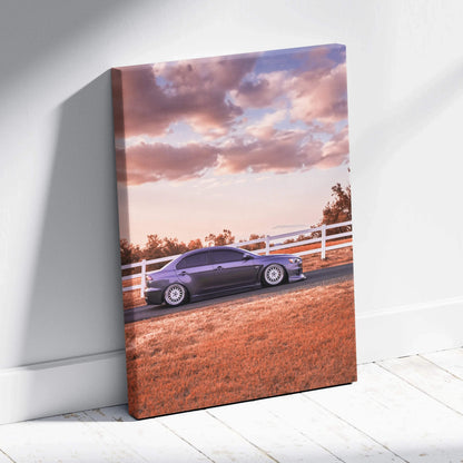 Mitsubishi Evo 10 parked by white fence at sunset on vertical canvas wall art.