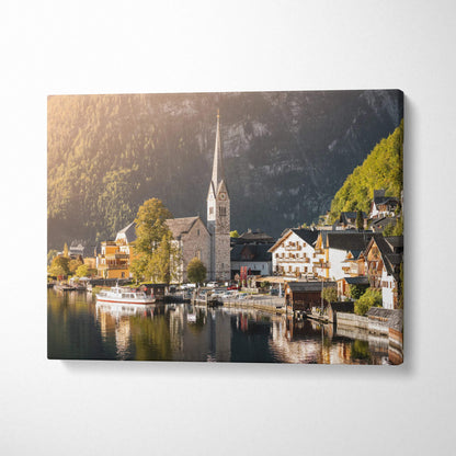 Canvas wall art featuring a serene lakeside village with a church and boats, vibrant natural lighting.