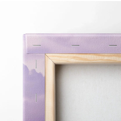 Close-up of stretched canvas art edge with lavender-purple paint and wooden frame staples visible.