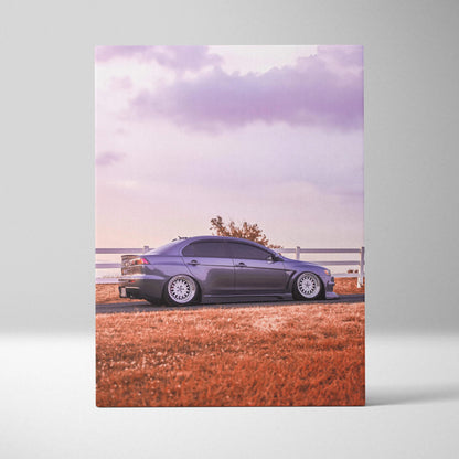 Mitsubishi Evo 10 parked on grass at sunset vertical canvas wall art with soft purple sky.