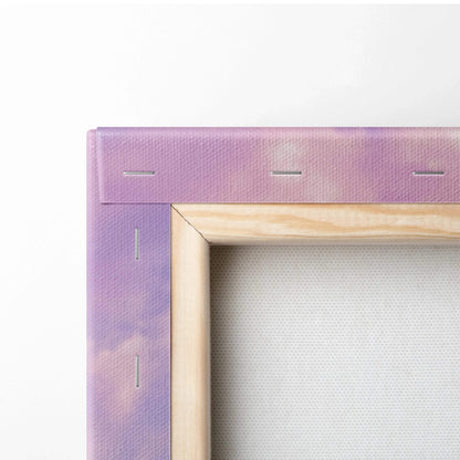 Close-up of natural wood frame with staples on purple museum-quality canvas wall art panel.