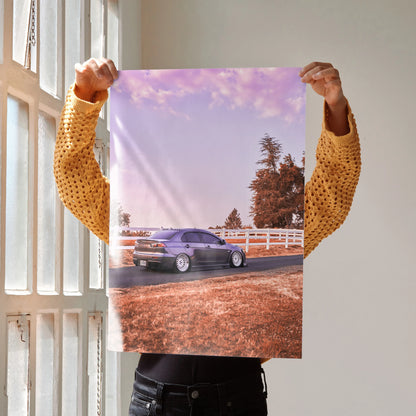 Mitsubishi Evo 10 parked by white fence at sunset poster wall art with purple skies.