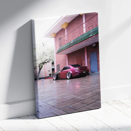 Vertical canvas art featuring a red Honda S2000 parked by a pink building, high-resolution wall art.