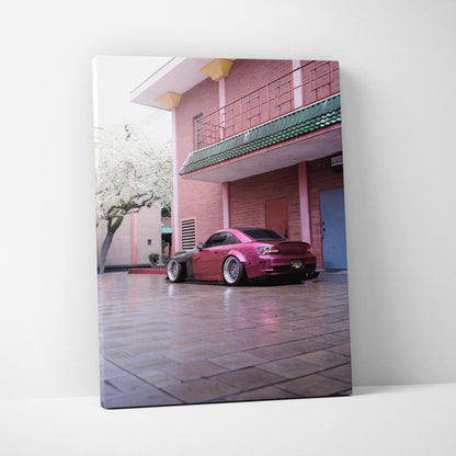 Vertical canvas art of a maroon Honda S2000 parked by pink building, modern wall art print.