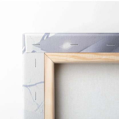 Close-up of wooden stretcher bar and white canvas with light gray patterns, showcasing wall art canvas texture.