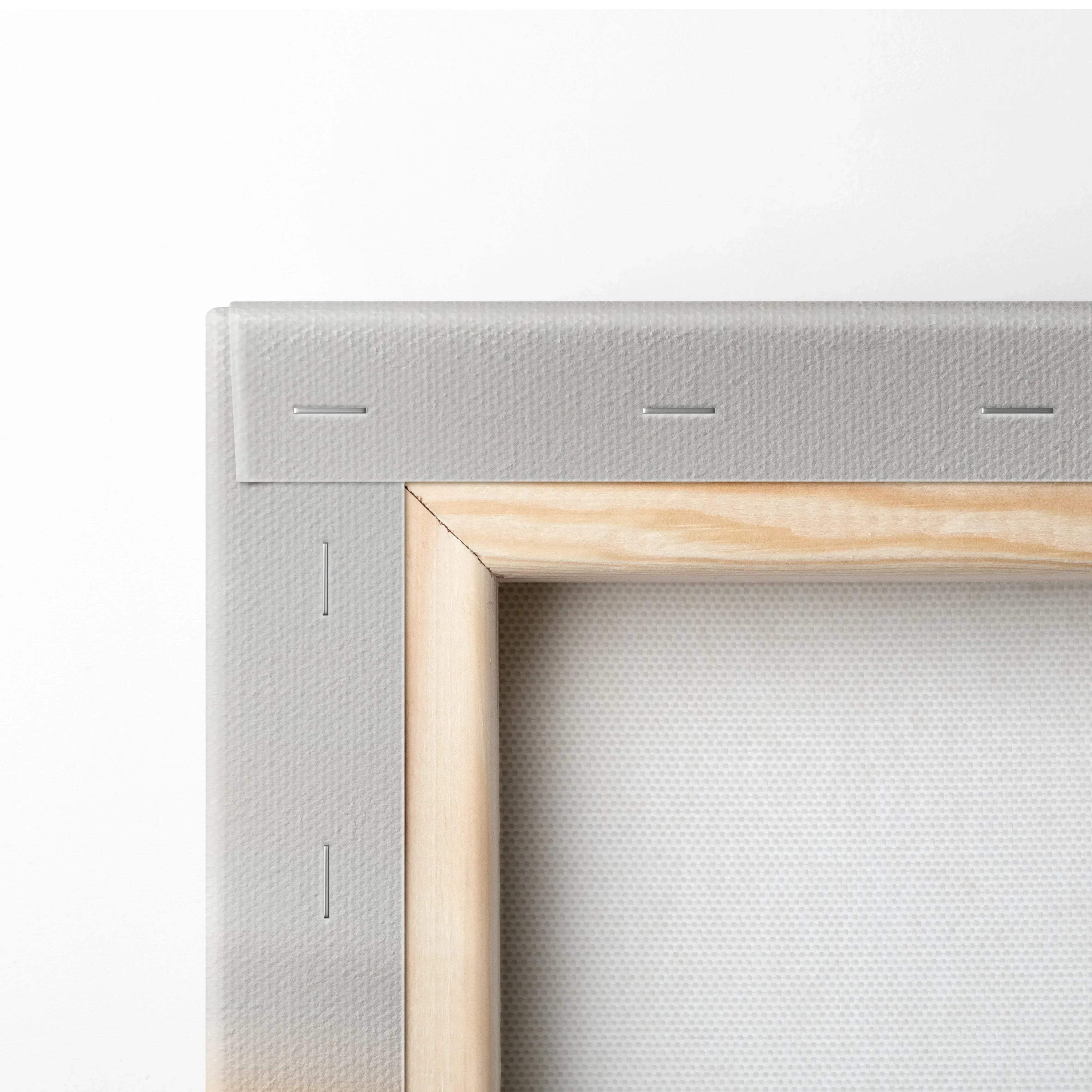 Close-up of natural wood stretcher bars and tightly wrapped beige canvas backing on art wall decor.