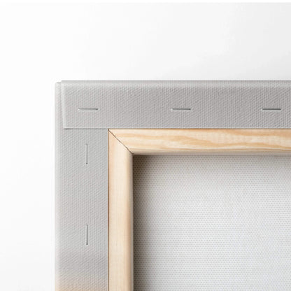 Close-up of natural wood stretcher bars and tightly wrapped beige canvas backing on art wall decor.