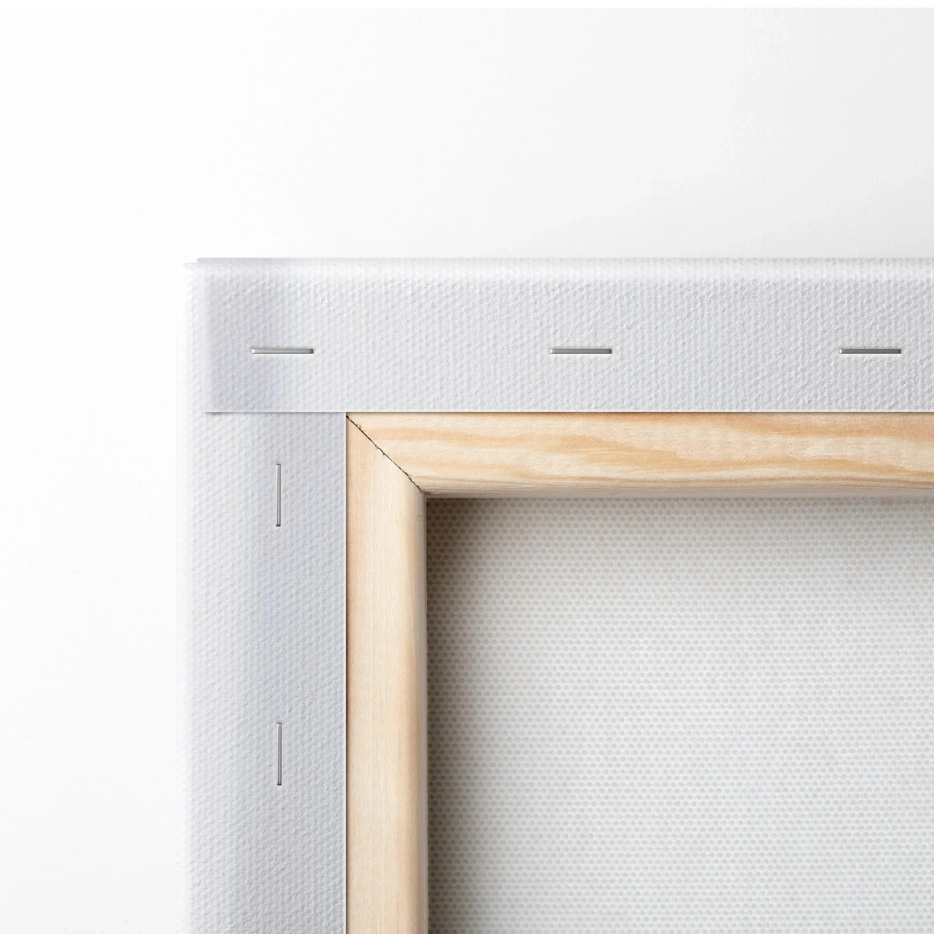 Close-up of wooden frame corner with white stretched canvas, vertical canvas art wall decor.