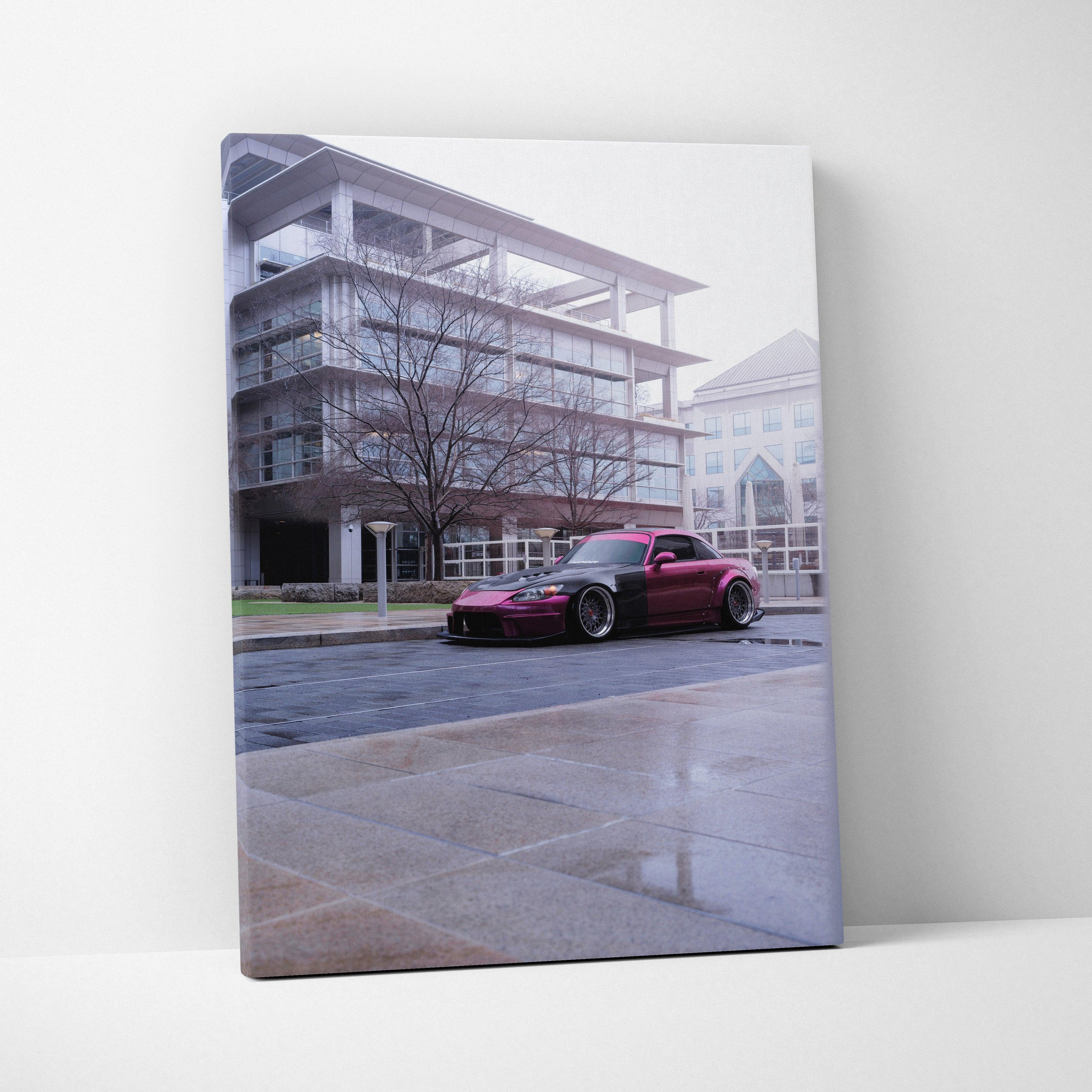 Vertical canvas art of a red Honda S2000 parked in front of modern glass building wall art.