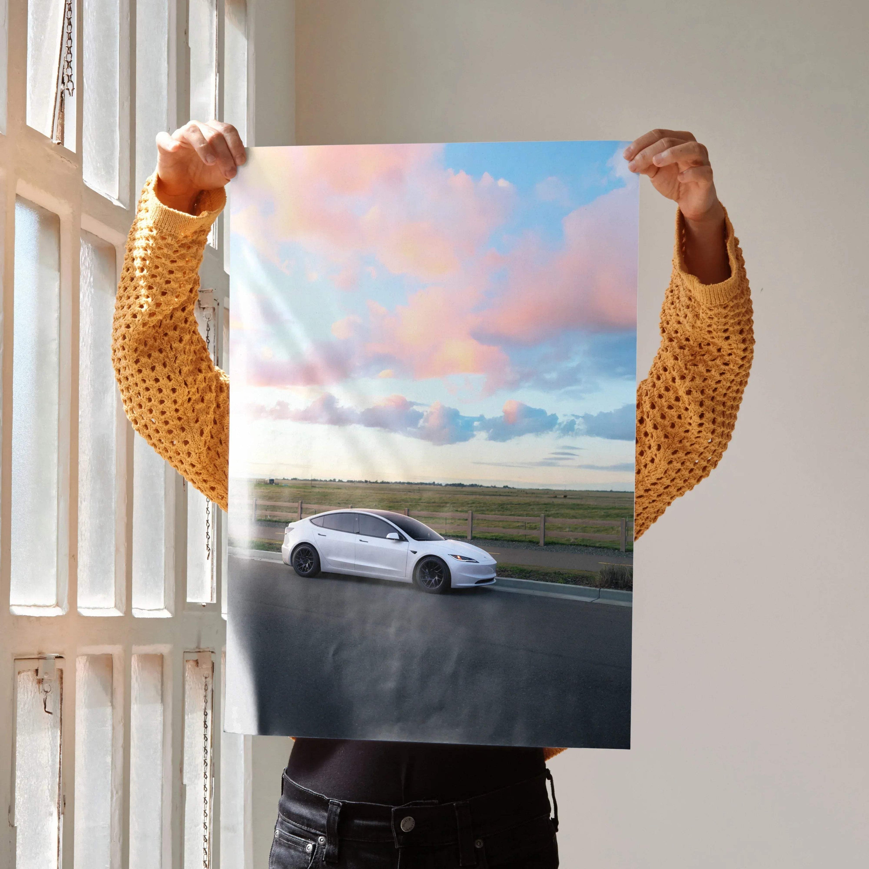 Tesla Model 3 Highland poster with sleek white car on road under pastel sunset sky wall art.