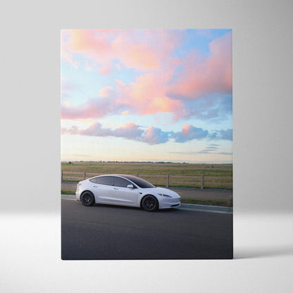 Tesla Model 3 Highland canvas art featuring white car on road with pastel sky wall art.