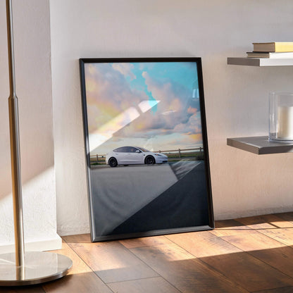 Tesla Model 3 Highland parked at sunset with colorful sky, framed poster wall art.