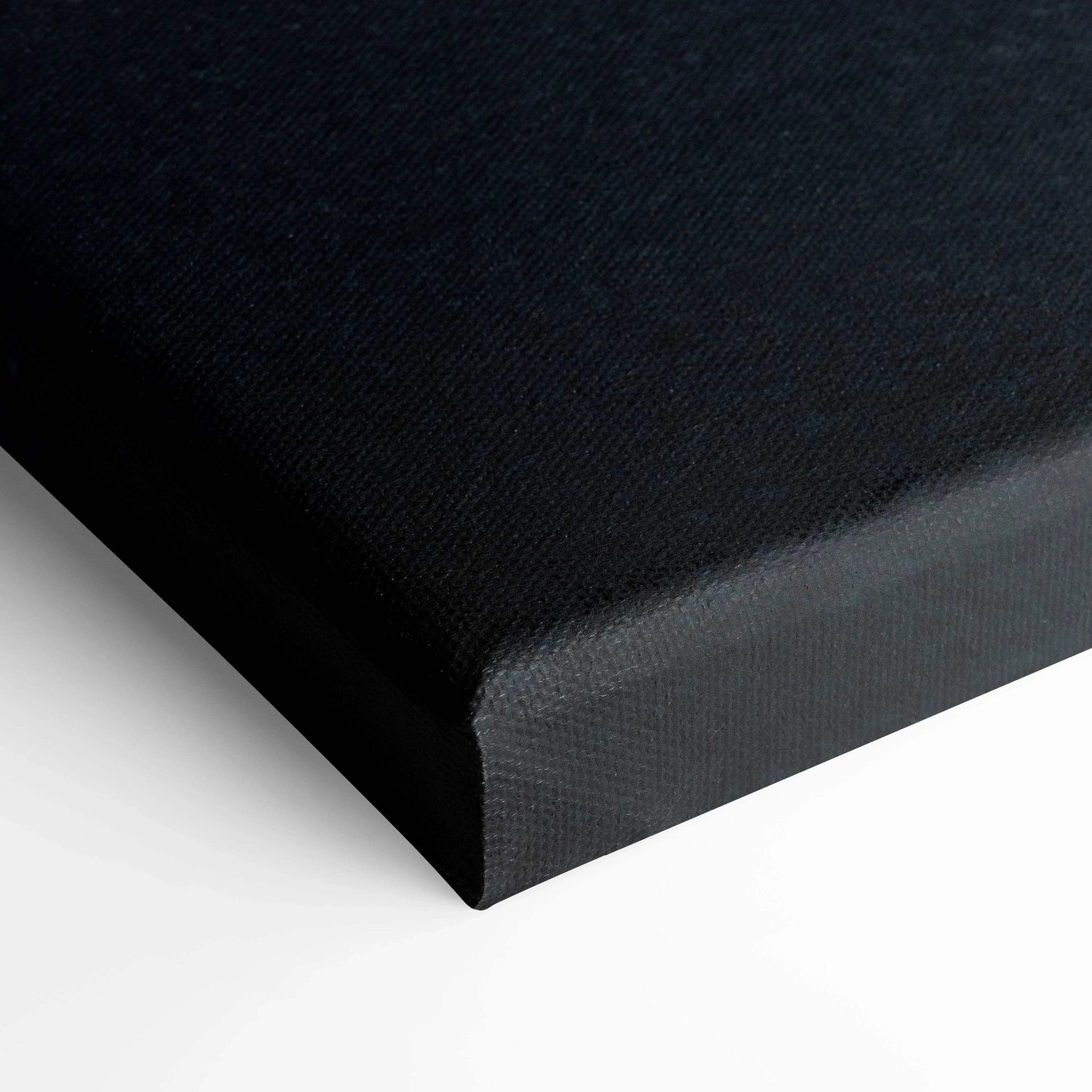 Black stretched canvas corner showing texture and clean folded edges for wall art and canvas art display.
