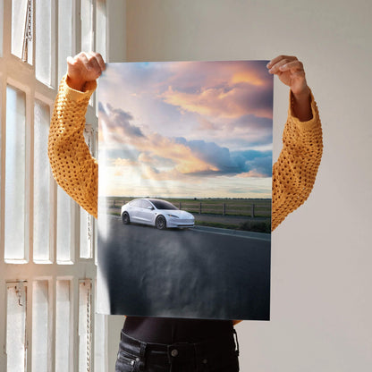 Tesla Model 3 Highland driving on open road at sunset poster wall art.
