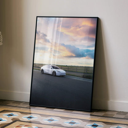 Tesla Model 3 Highland parked on road under colorful sunset sky, sleek car poster wall art.