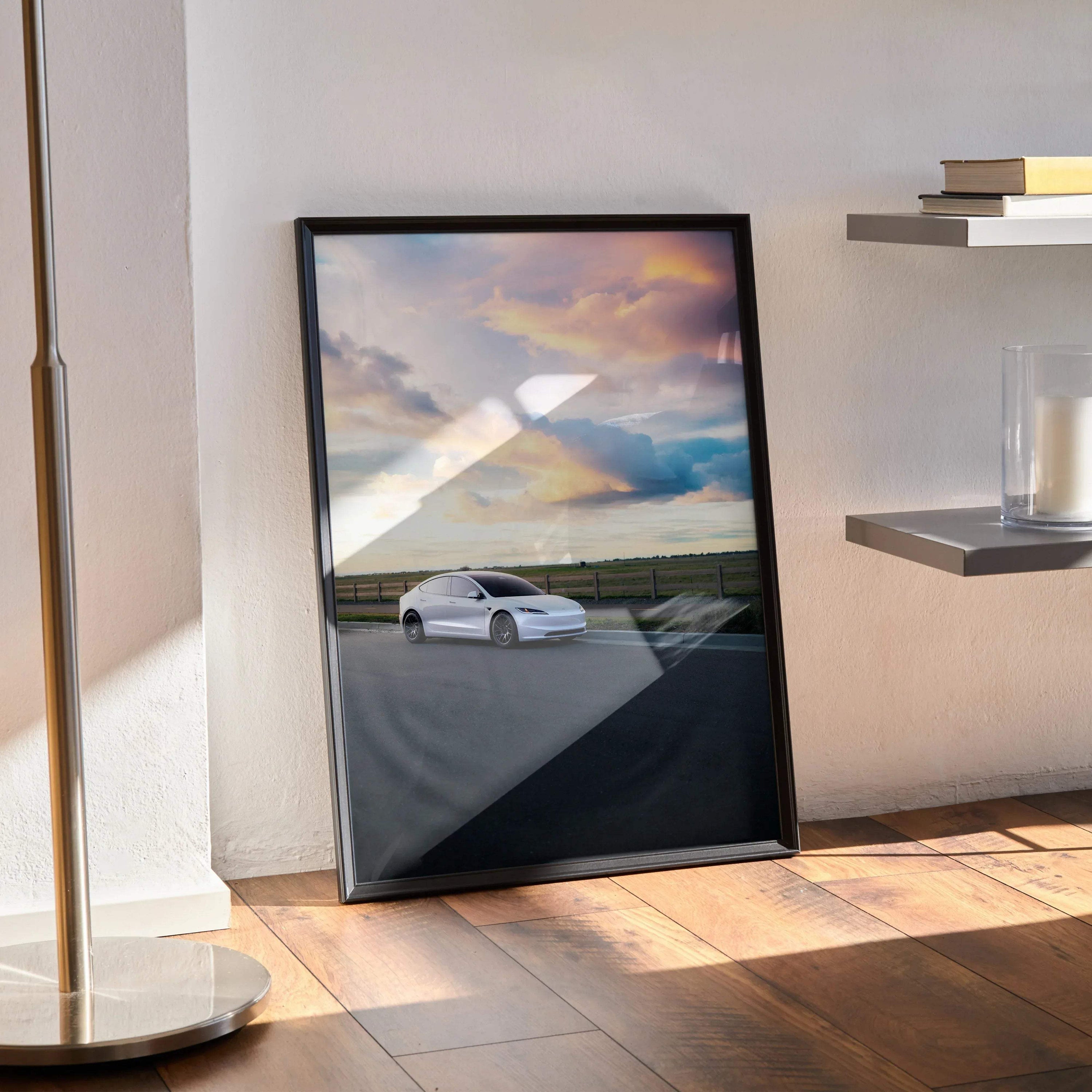 Tesla Model 3 Highland white electric car wall art poster with dramatic cloudy sky and road scene in black frame.