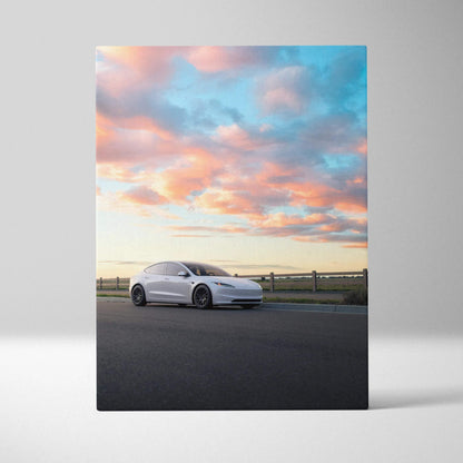 Tesla Model 3 Highland parked on road under vibrant sunset sky canvas wall art.