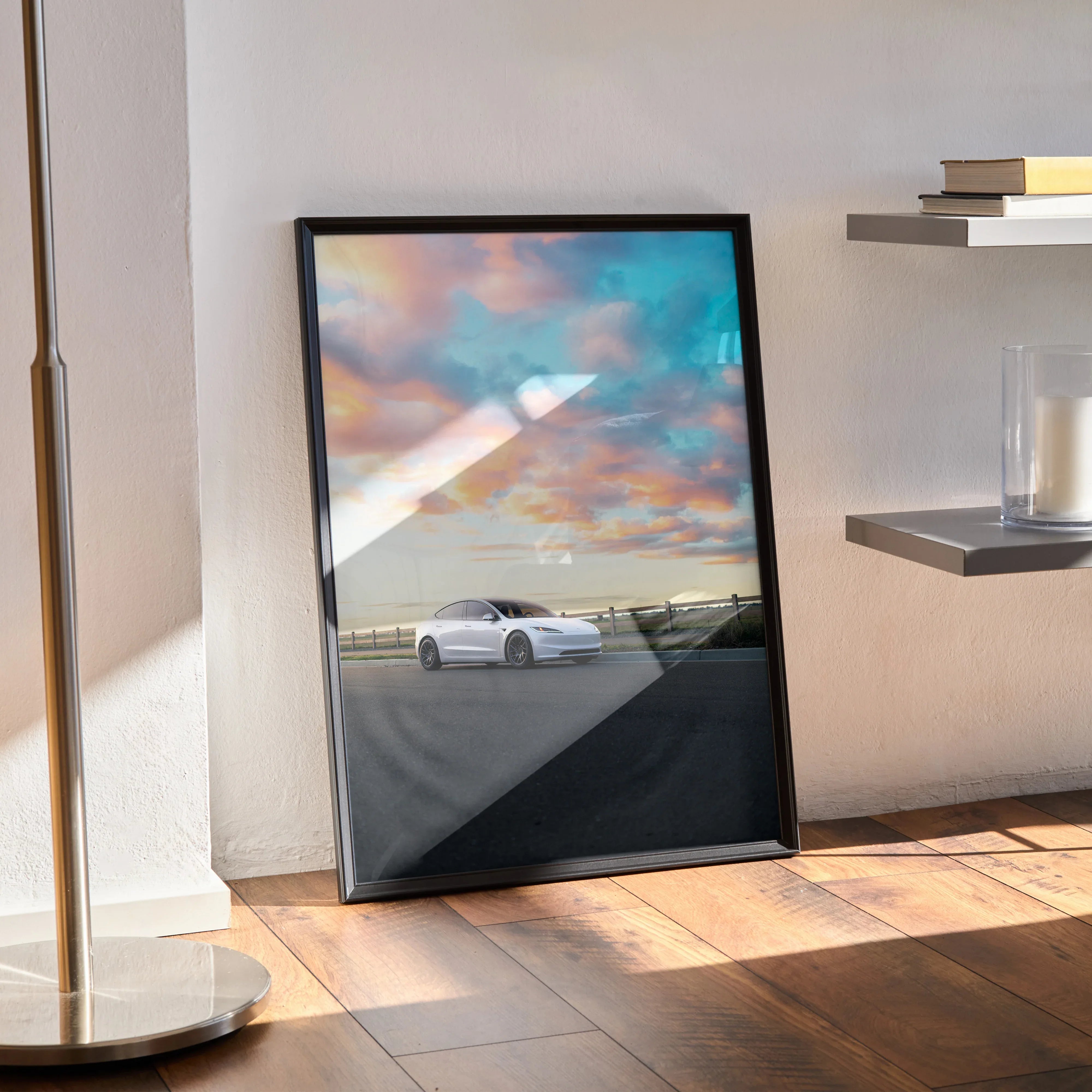 Tesla Model 3 Highland parked under colorful sunset sky, minimalist poster wall art in black frame.