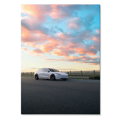 Tesla Model 3 Highland parked on road at sunset with colorful clouds, poster wall art.