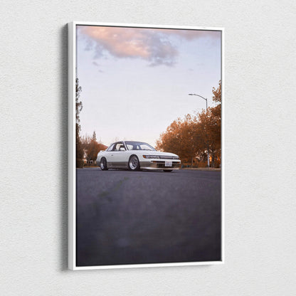 Vertical canvas wall art featuring a white Nissan 240sx S13 Silvia on an empty road under a cloudy sky.