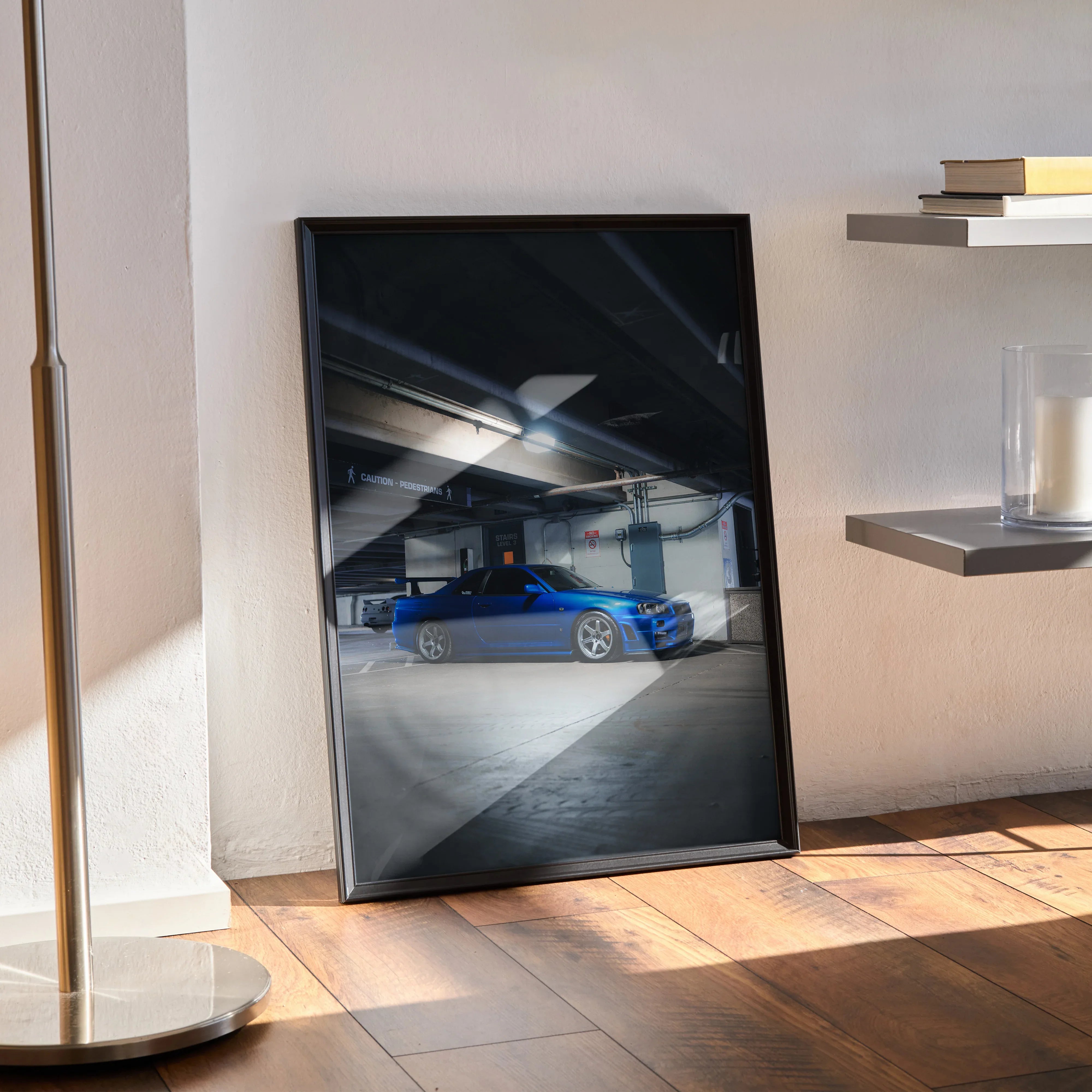 Nissan R34 GTR Skyline poster with blue sports car in garage, displayed as modern wall art.
