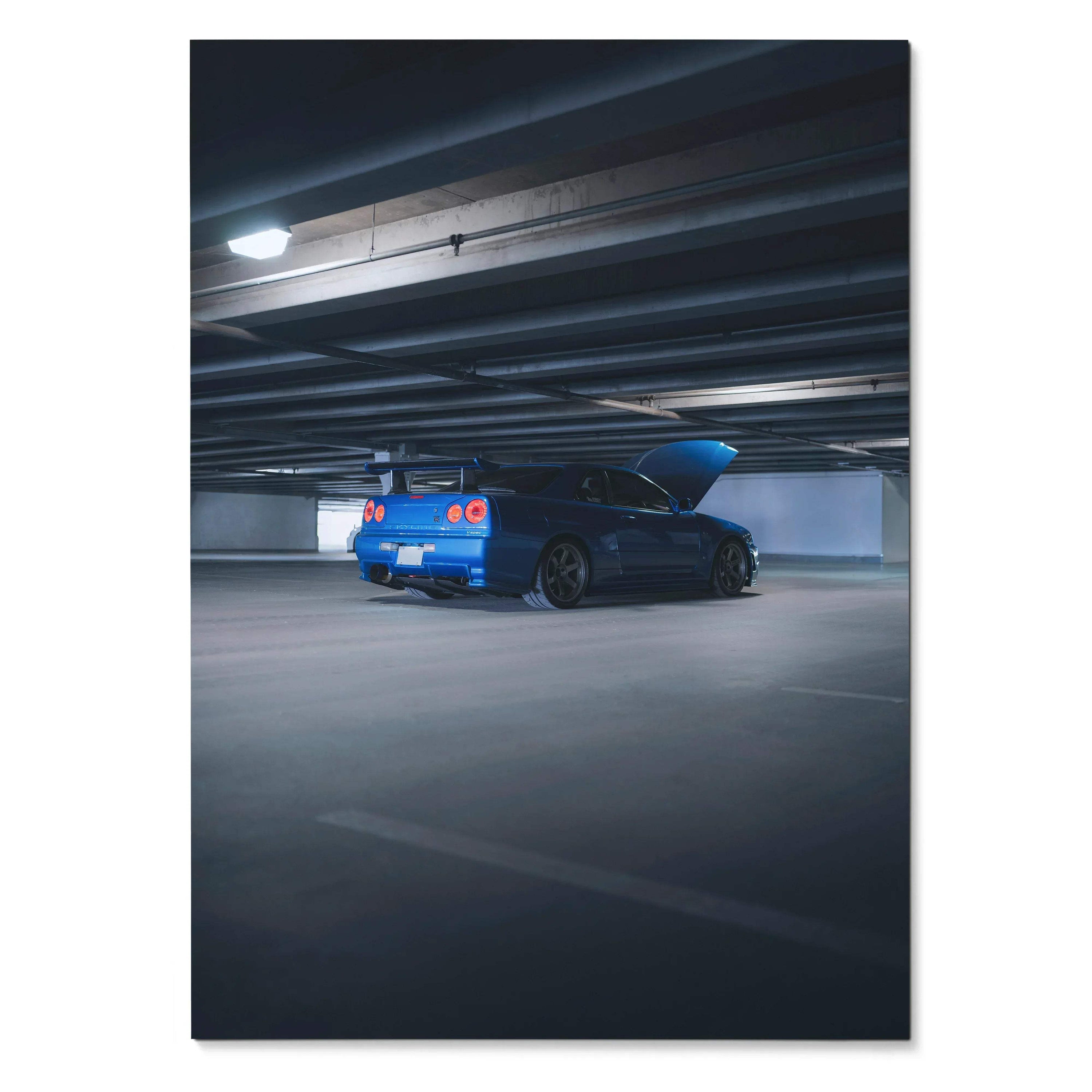 Nissan R34 GTR Skyline in blue parked under garage lighting poster wall art.
