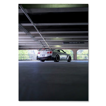 Nissan GTR R35 sports car parked in a dimly lit garage poster wall art.