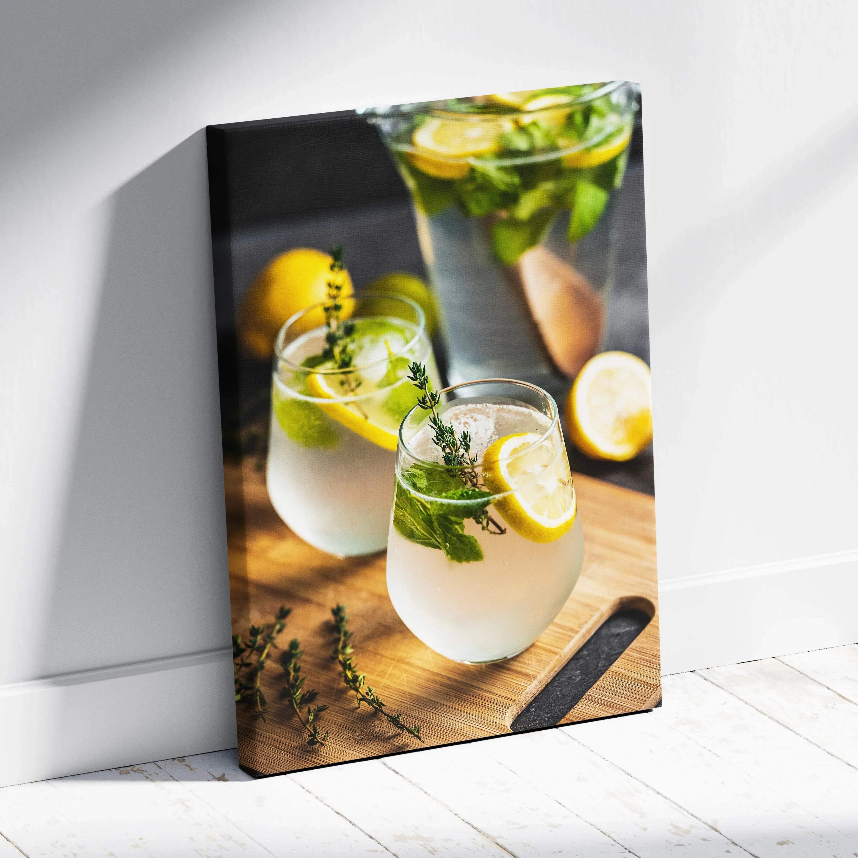 Canvas wall art featuring vibrant lemons and fresh mint in clear glasses filled with lemonade, set on a rustic wooden.