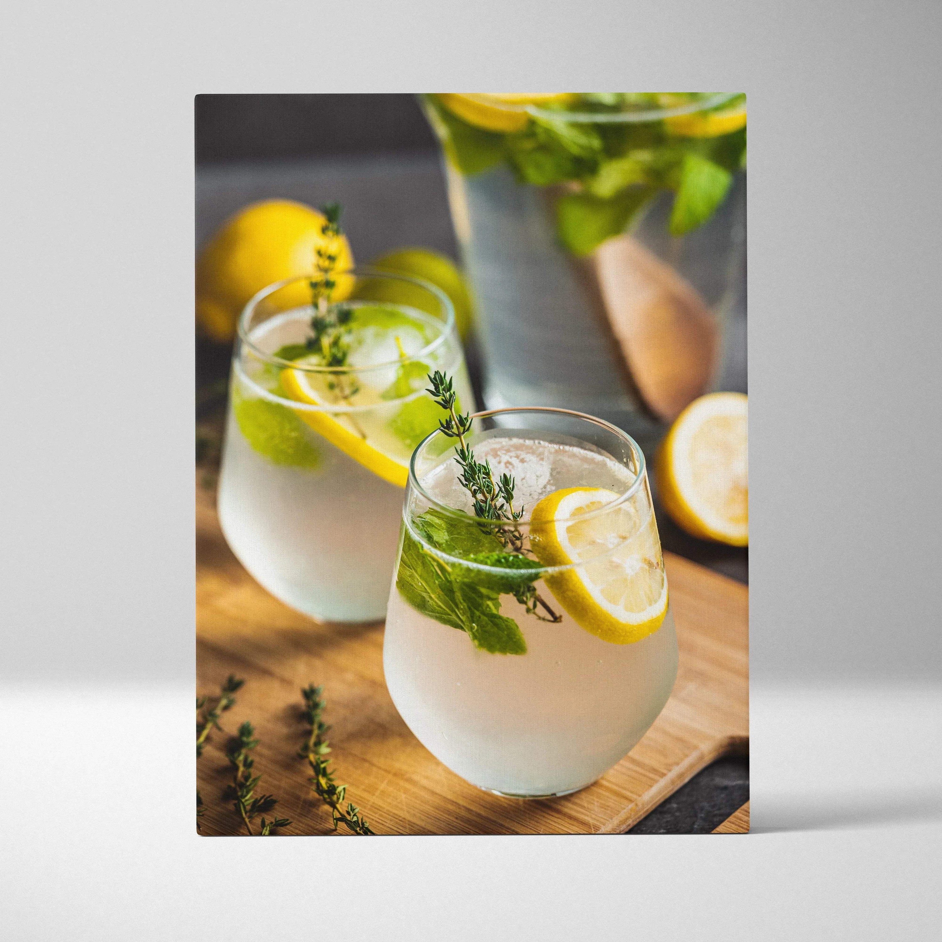 Canvas print wall art featuring two glasses of lemon water with fresh mint and thyme on wooden surface, vibrant and.