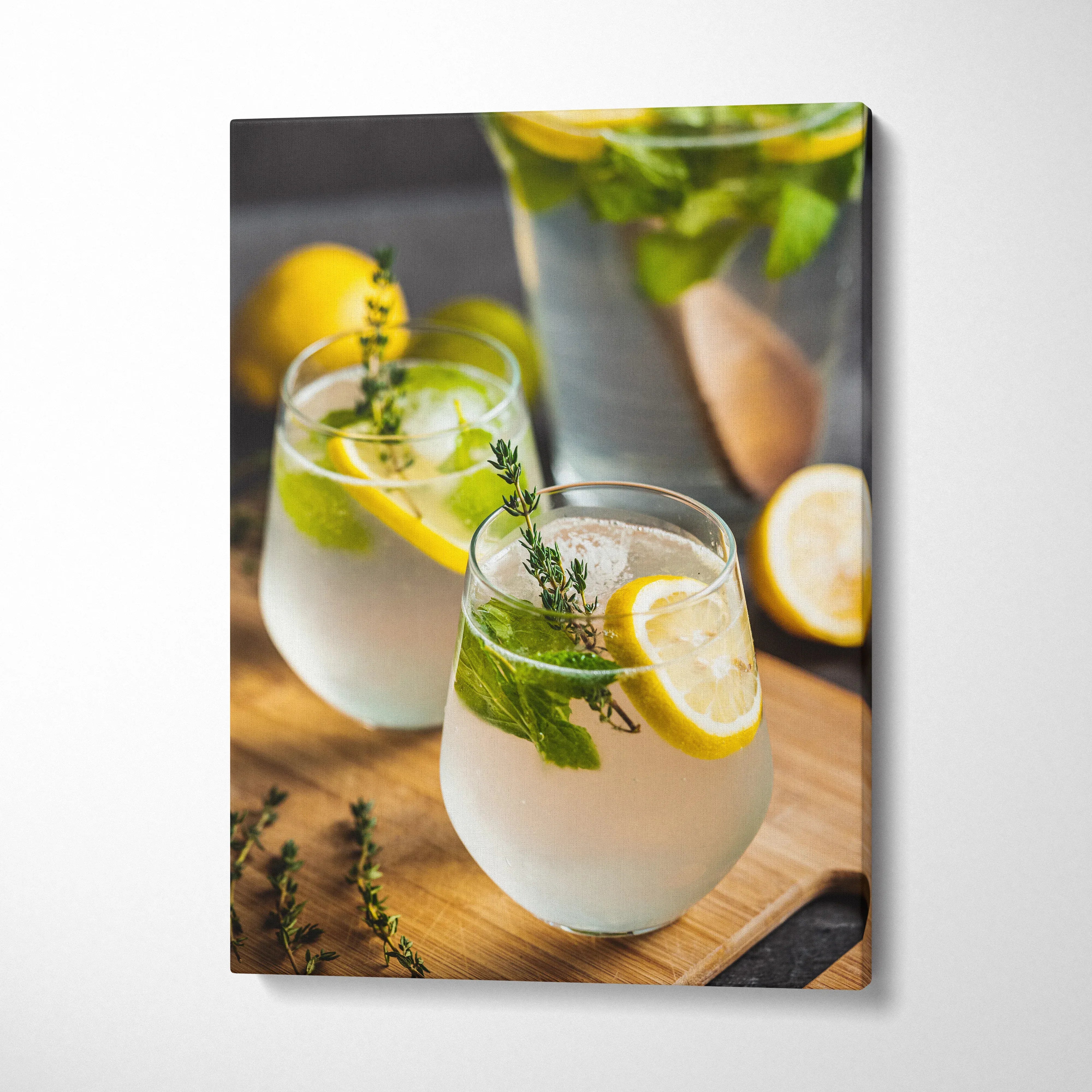 Canvas wall art featuring vibrant lemon water in glasses with fresh mint, perfect kitchen decor.