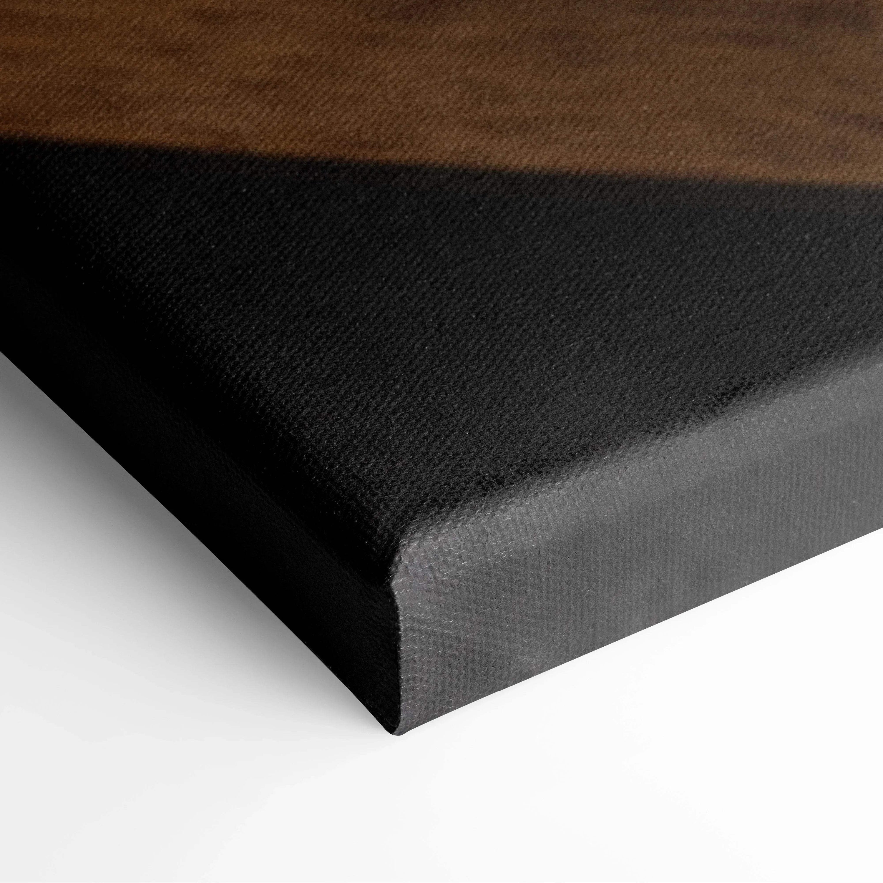 Close-up of black stretched canvas edge with smooth texture and tight corners.