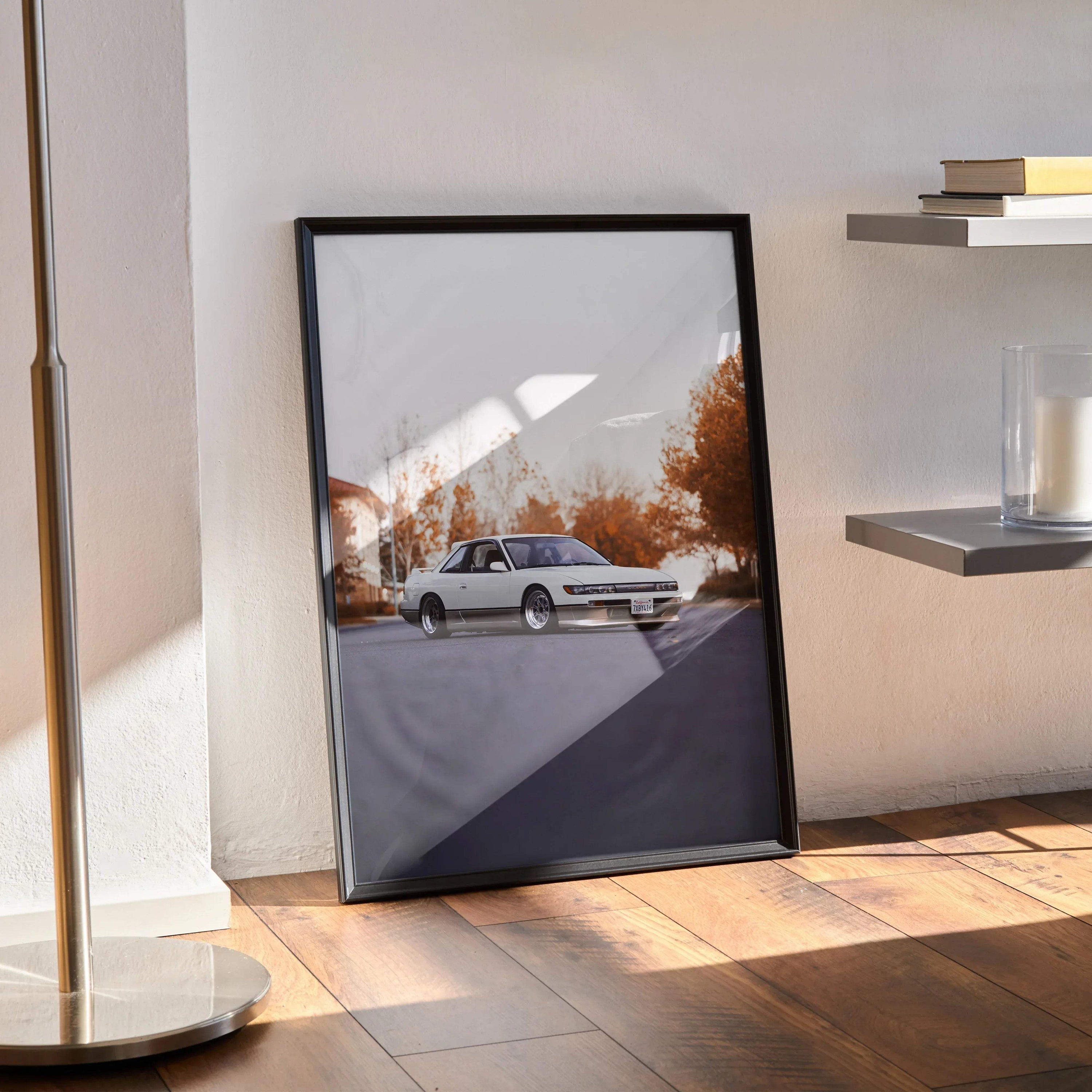 Nissan 240sx S13 Silvia poster wall art in black frame with autumn trees background.