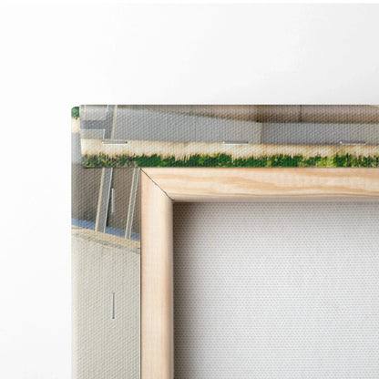 Corner close-up of stretched canvas wall art with natural wood frame showing texture and print edge.