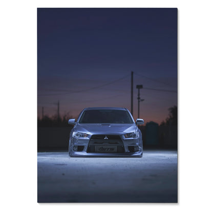 Mitsubishi Evo X front view poster with sleek headlights and dark evening sky wall art.