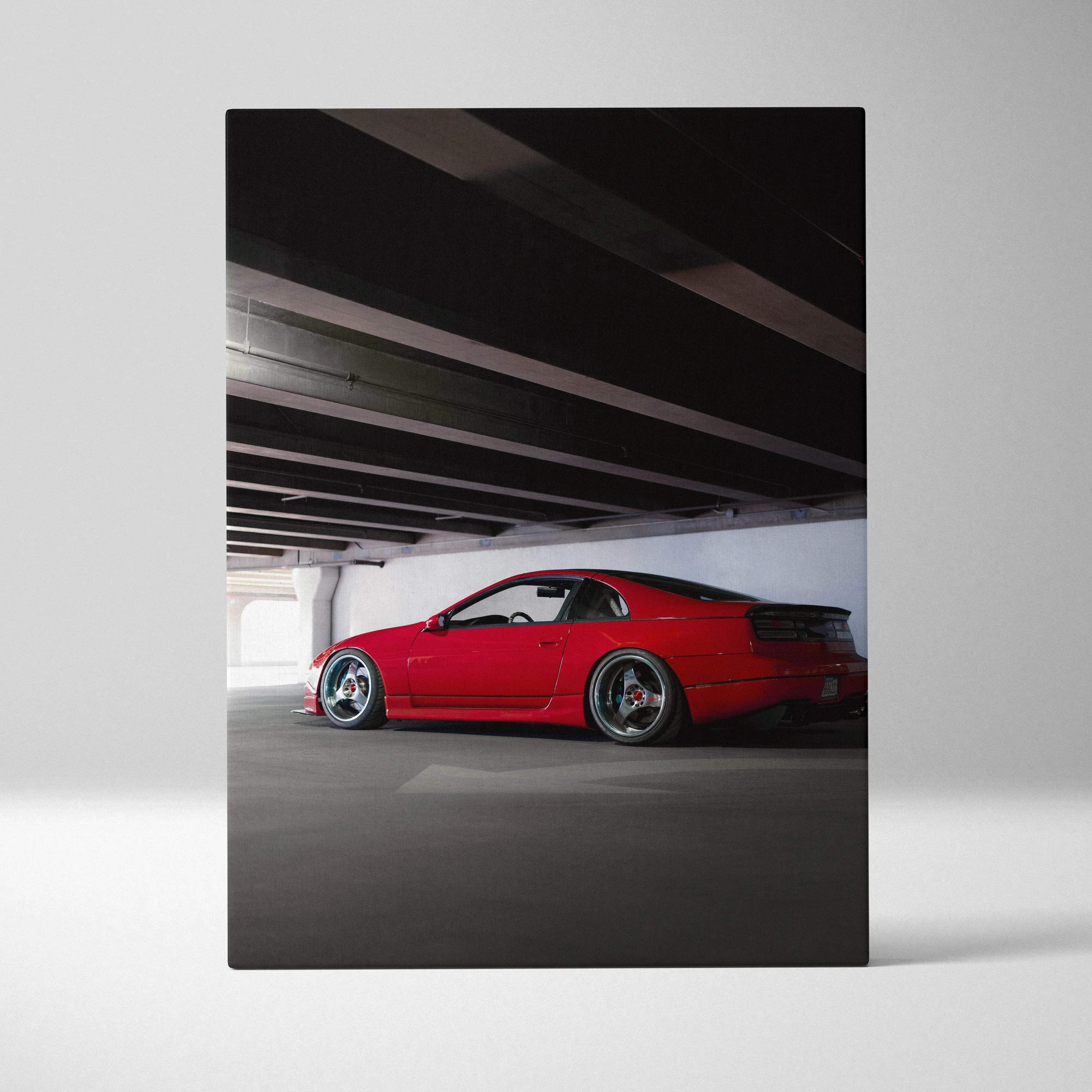 Canvas wall art featuring a bold red nissan 300zx with black roof and custom alloy wheels in a dark garage
