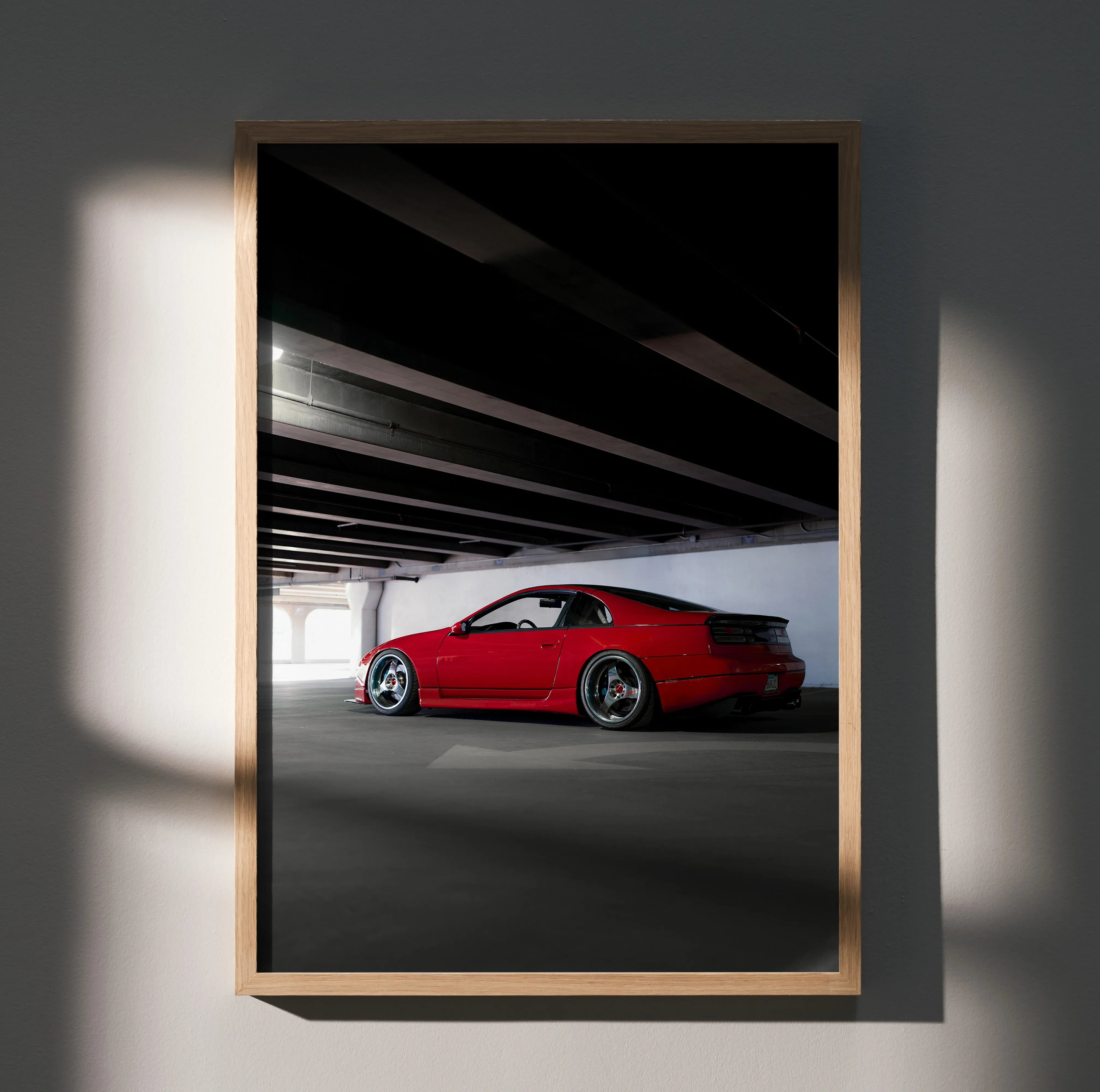 Red Nissan 300ZX parked under a bridge with dramatic shadows, poster wall art.