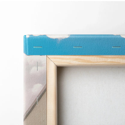 Close-up of wooden frame and textured blue sky section on vertical canvas art wall print.