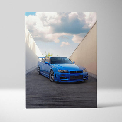 Blue Nissan R34 GTR parked between walls with dramatic clouds on vertical canvas wall art.