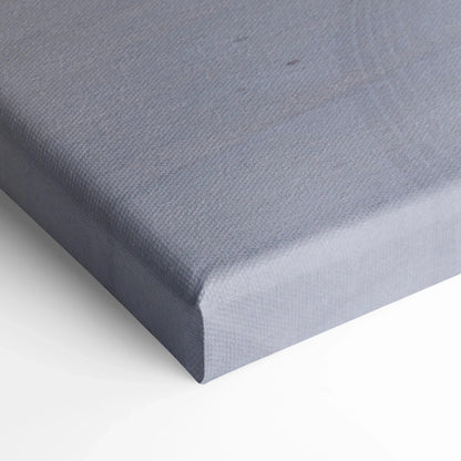 Close-up of gray textured canvas art corner with tight fabric wrap, vertical wall art print.