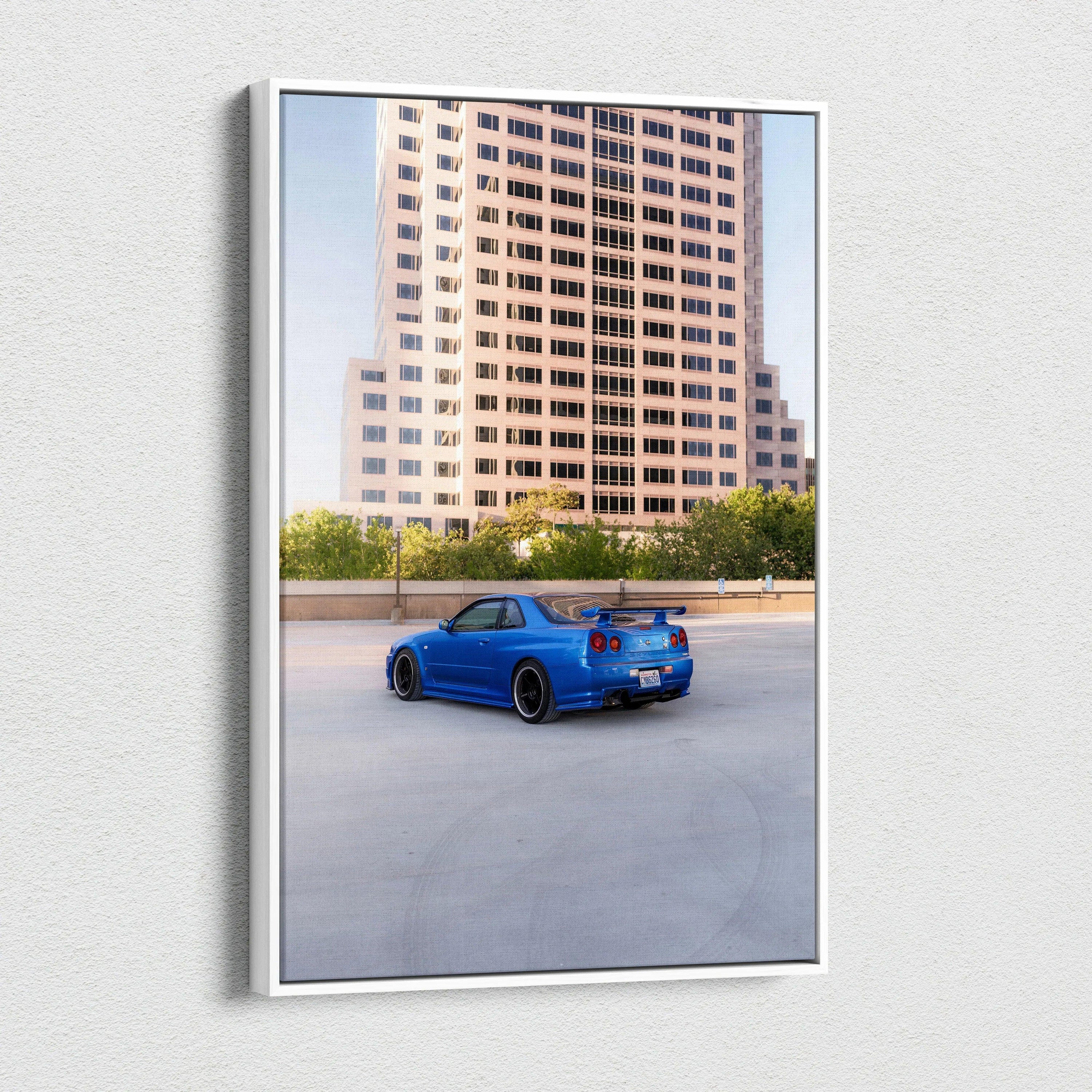 Vertical canvas art of blue Nissan R34 GTR parked near city building wall art print.