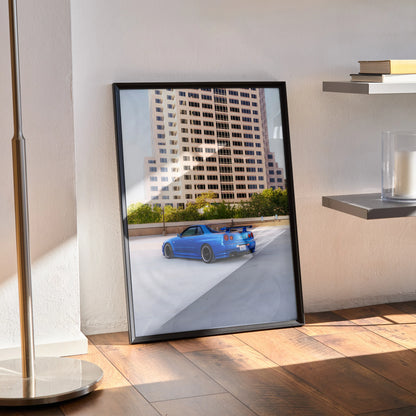 Nissan R34 GTR Skyline blue sports car poster leaning on floor, modern interior wall art.