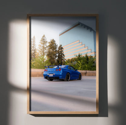 Nissan R34 GTR Skyline blue car poster with modern building and trees wall art.