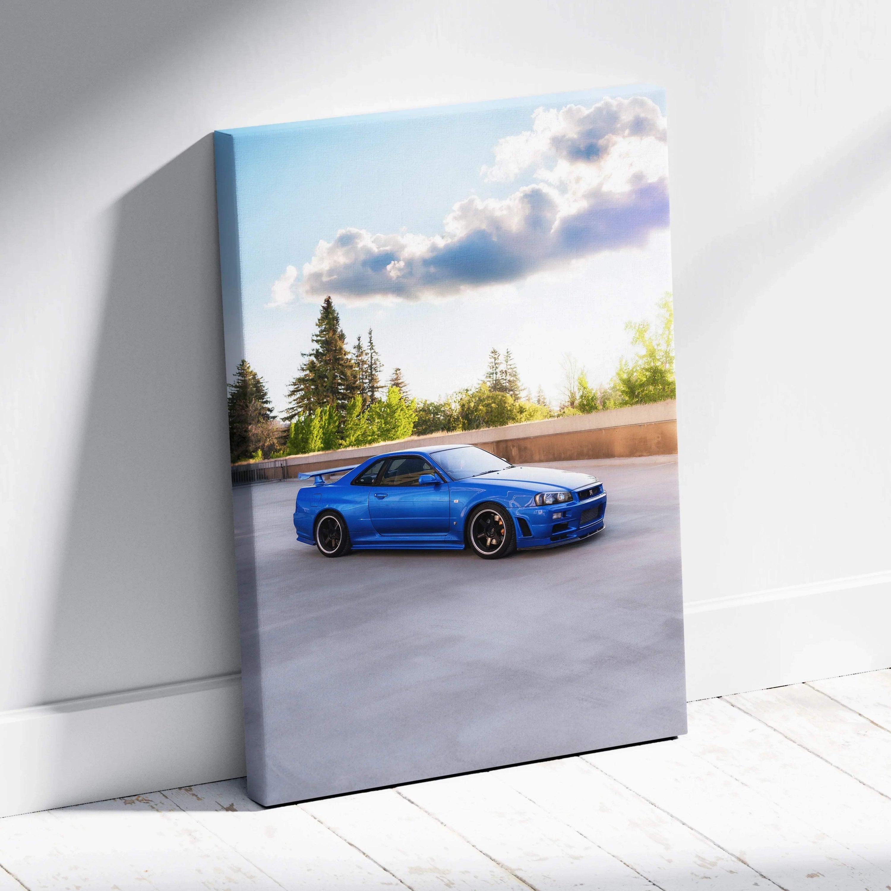 Blue Nissan R34 GTR parked under blue sky on vertical canvas wall art.